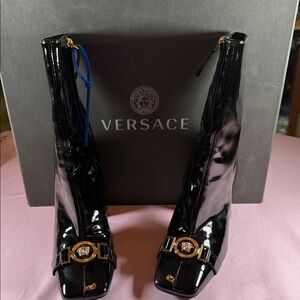 Versace Glossy Black Heeled Boots with Gold Accents